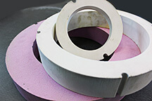 Pink and white aluminum oxide dressing rings 